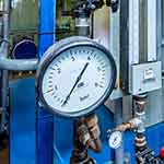 Industrial pipework with pressure gauges