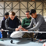 Students building a model plane