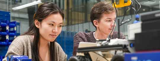 Two students sat at a lab bench