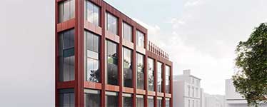 Tall brown wooden buildings made up of large rectangular panels of glass