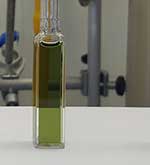 Tall bottle of coloured liquid in a laboratory